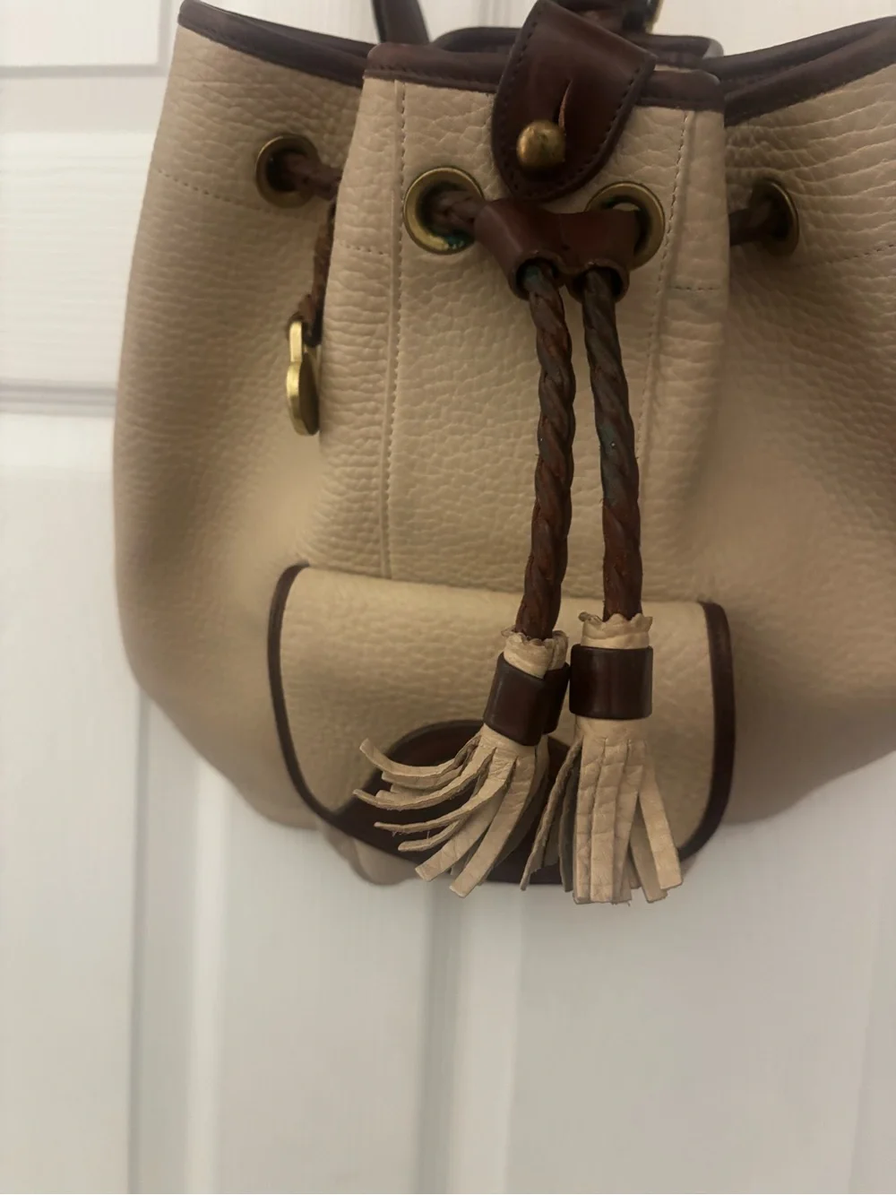 Dooney & Bourke Beige and Brown Leather Drawstring Bucket Backpack